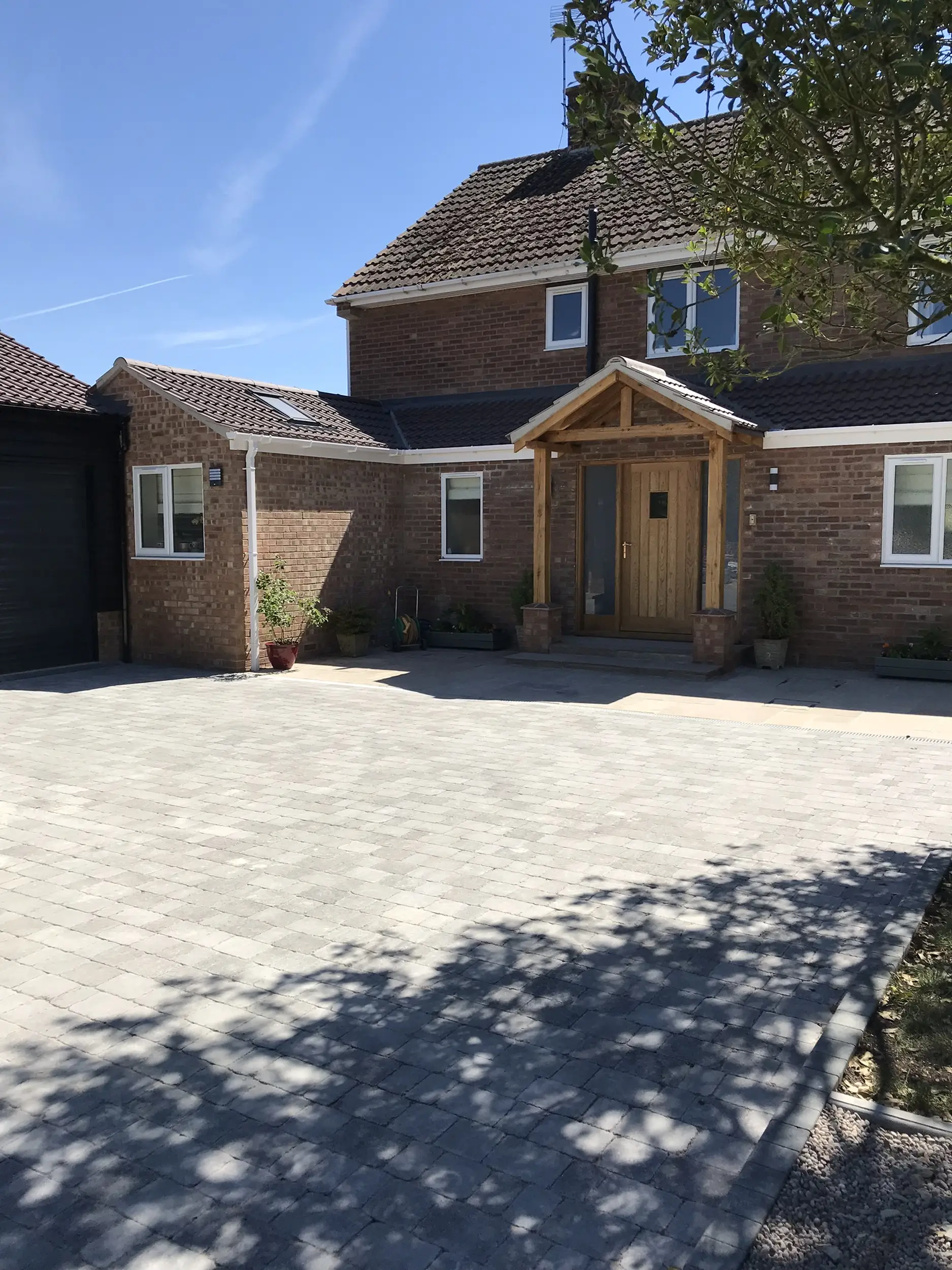 Completed driveway outside a brick home